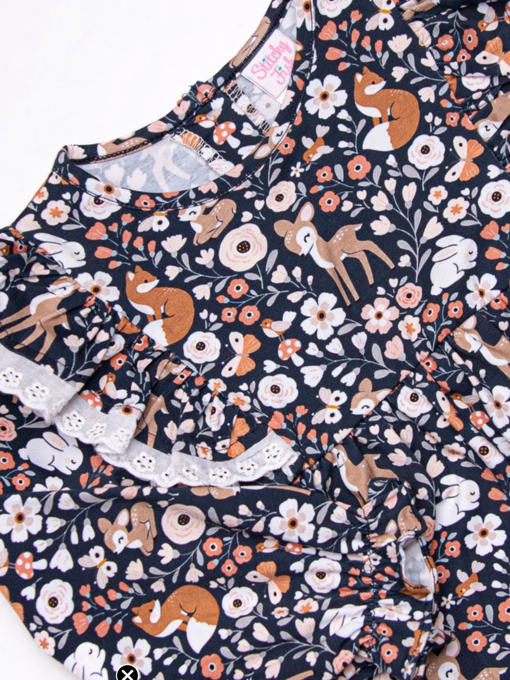 Charming Stitchy Fish Woodland-themed top features floral & forest creatures.